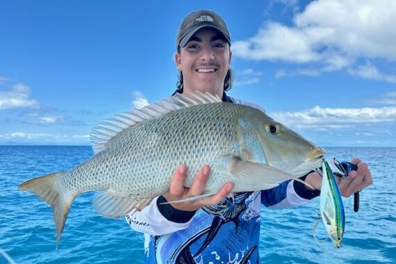 Angler holding his freshly caught fish