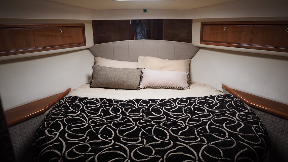 Allure fishing vessel main bedroom with a double bed