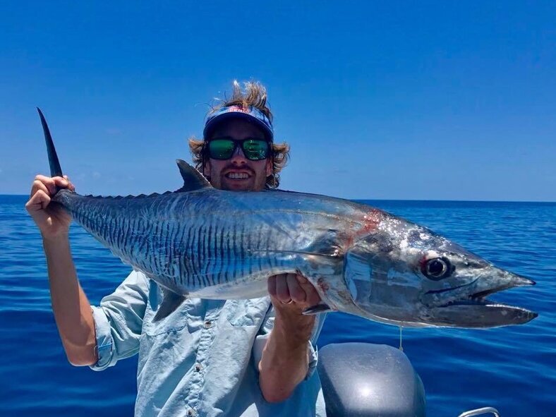 male angler with a great barrier reef mackerel
