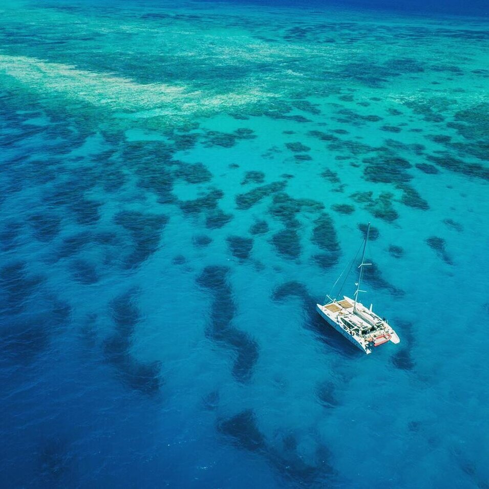 Aerial photo of Liquid Desire vessel on the Great Barrier Reef