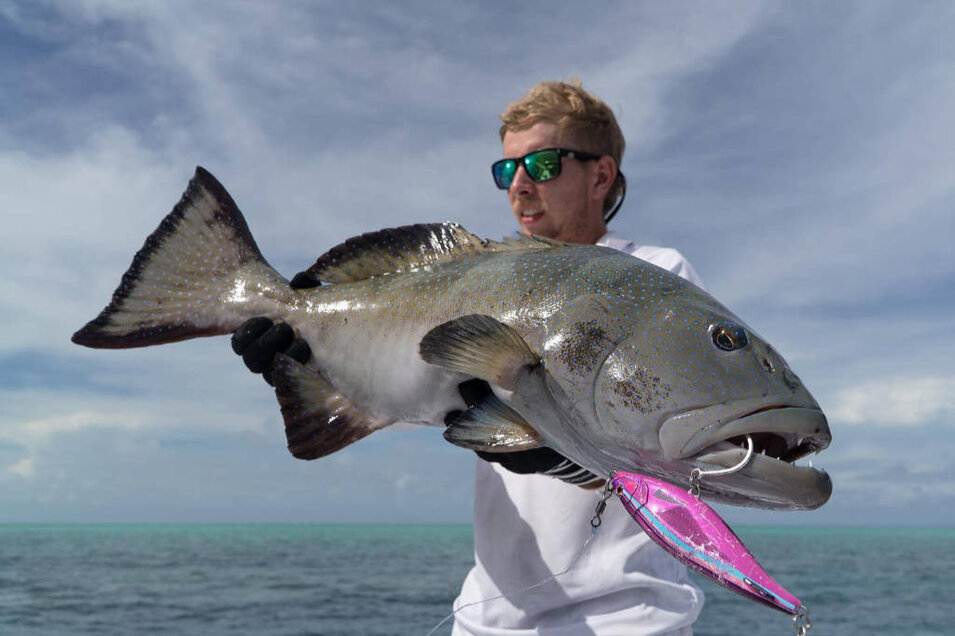 Fisherman with a freshly caught Potato cod